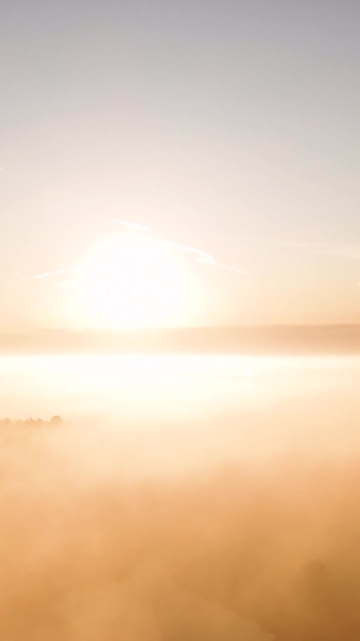 Golden Sunrise or Sunset over a Misty Landscape