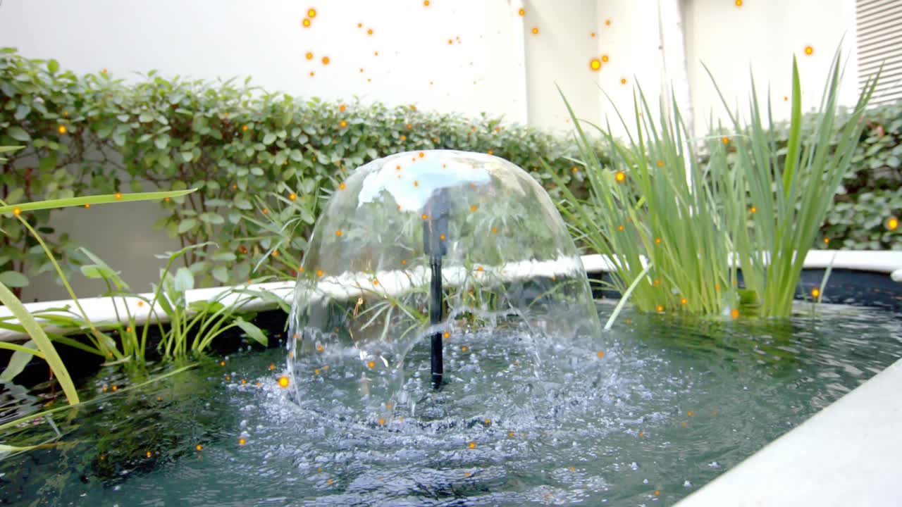 Pump pulse causing nozzle making water dome, droplets forming pond ripples for decoration