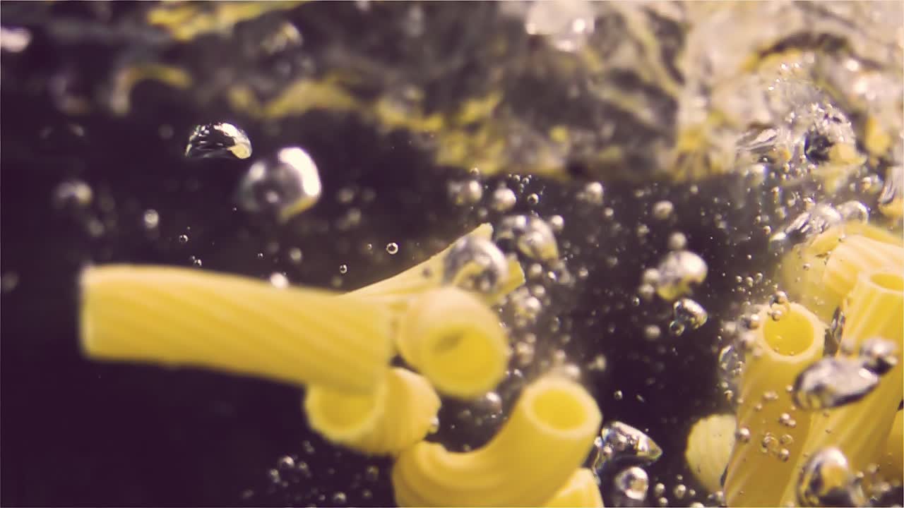 Pasta falling into water