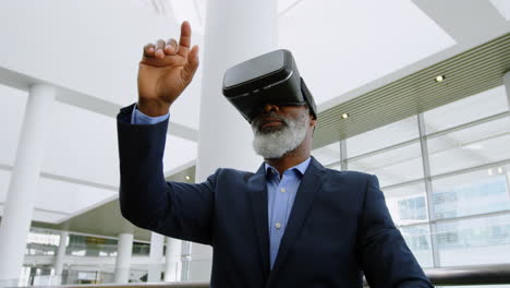 Businessman experiencing VR headset in the office 4k
