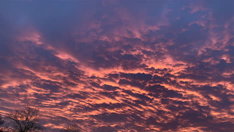 epic colorful cloudscape during sunrise early in the morning,static wide shot
