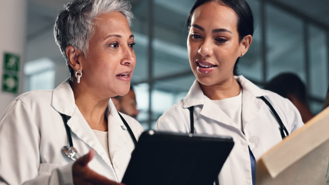 Doctor, women together and tablet with documents
