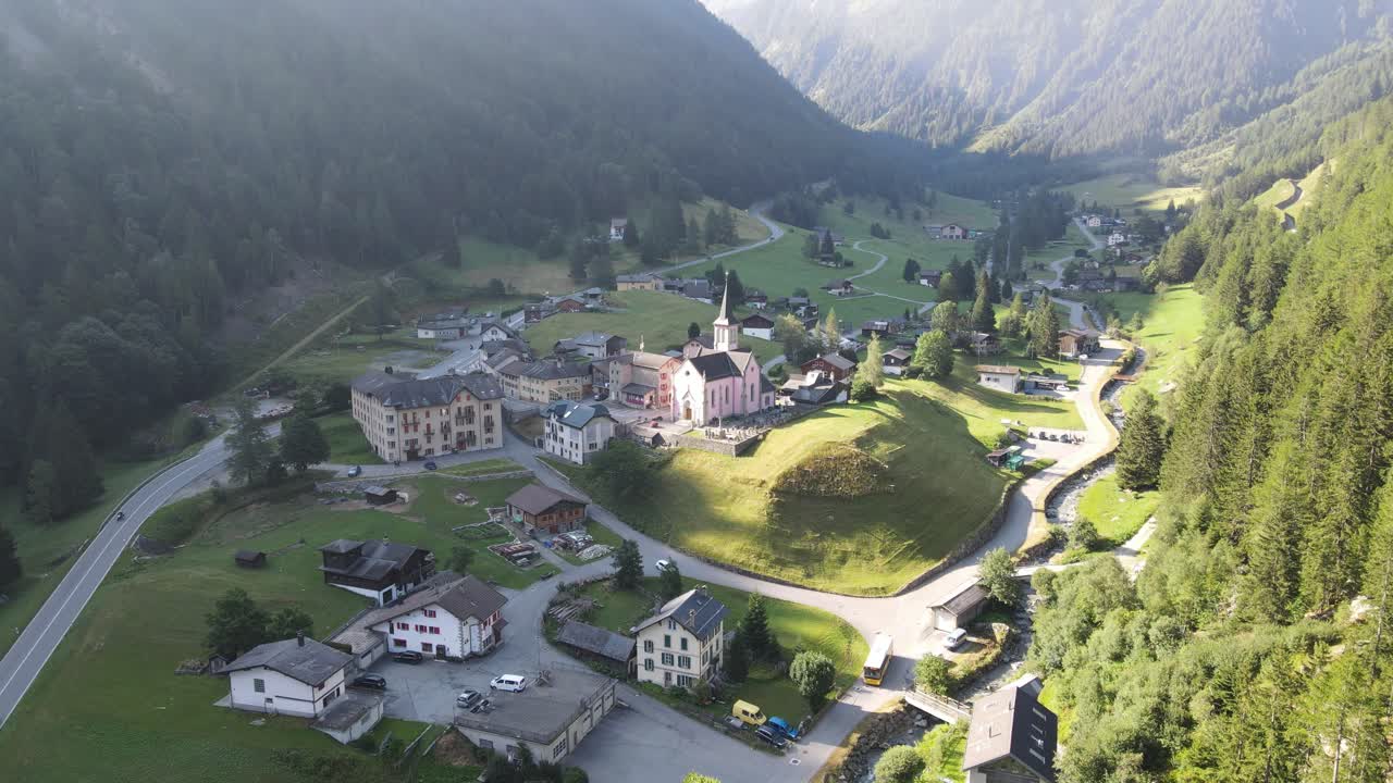 Aerial View of a Picturesque Alpine Village in a Mountain Valley