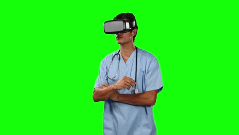 Front-view-of-doctor-using-virtual-reality-touching-screen-with-green-screen