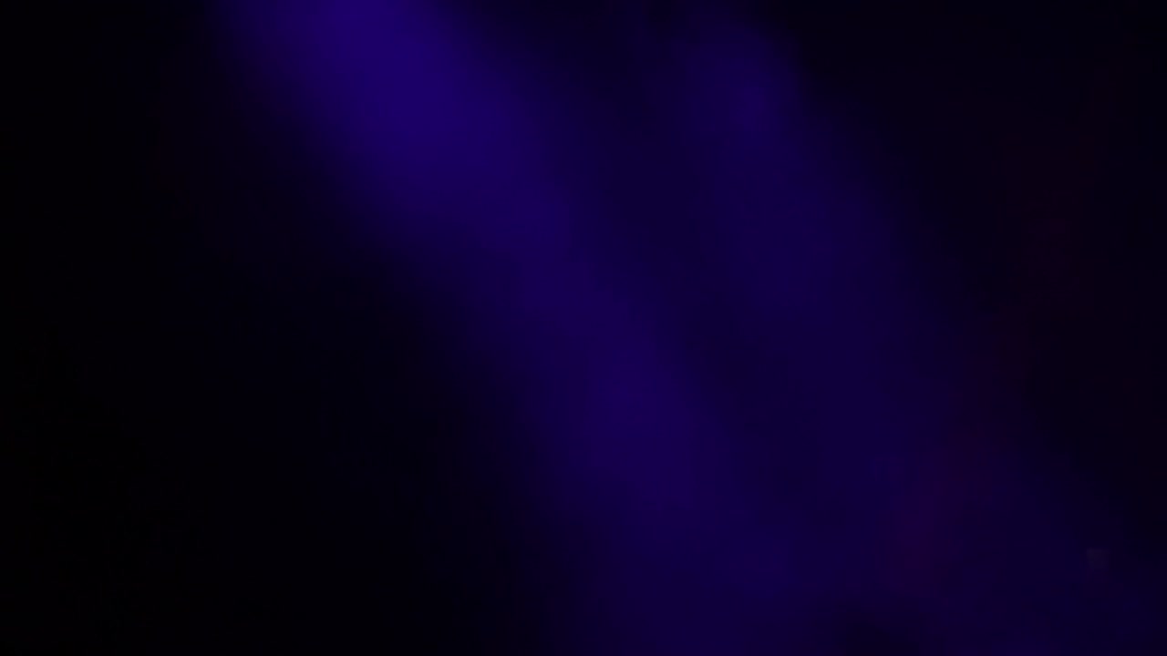 Smoke columns with blue lights in the stage of a show