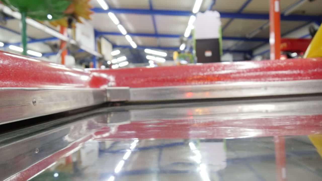 Close-up of playing air hockey at an amusement park.