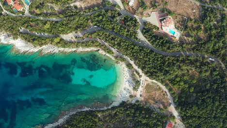 Pebble-Emplisi-Beach,-emerald-sea-at-secluded-bay,-Kefalonia-island