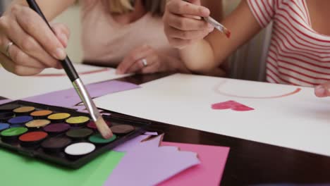 Mother-and-daughters-painting-together