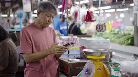 elderly man shopping at a market