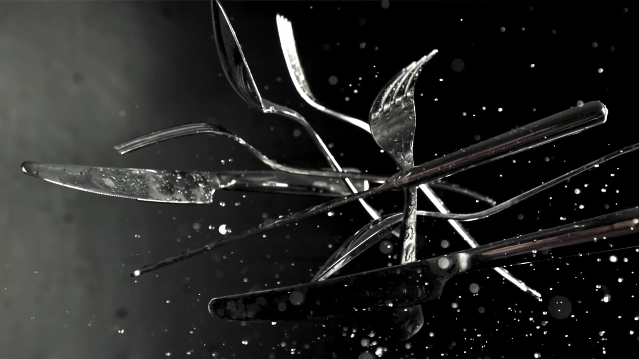 Cutlery Falling and Splashing with Water in Slow Motion