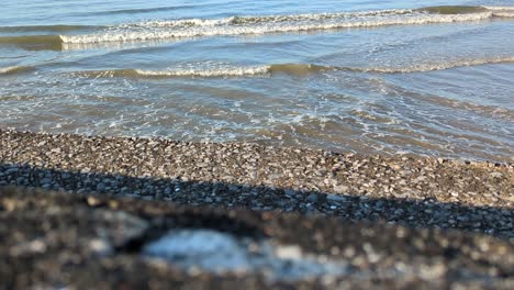 sea waves gently breaking on steps in swansea bay