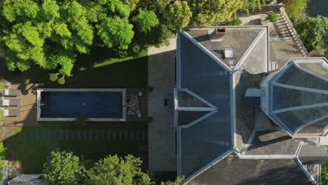 aerial top-down showcasing a castle-like villa with a private pool on the lez river