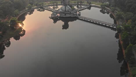 Reveal-shot-of-Abandoned-Waterpark-Hue-at-sunrise,-aerial