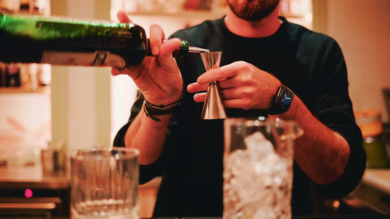 Close up of an elegantly arranged restaurant table with plates, glasses, cutlery and soft ambient lighting