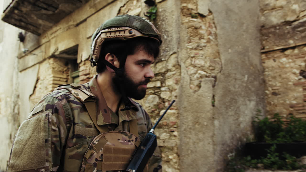 Soldier Walks In A War Destroyed Village Houses