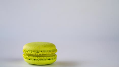 pile of multicolored macaroons on white background in stop motion