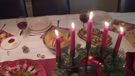 christmas dinner, candle focus, handheld, close