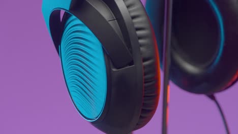 close-up of gaming headphones with neon lighting