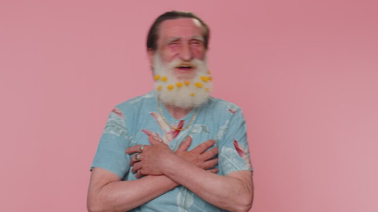 Joyful man laughing out loud after hearing ridiculous anecdote, funny joke, feeling carefree amused