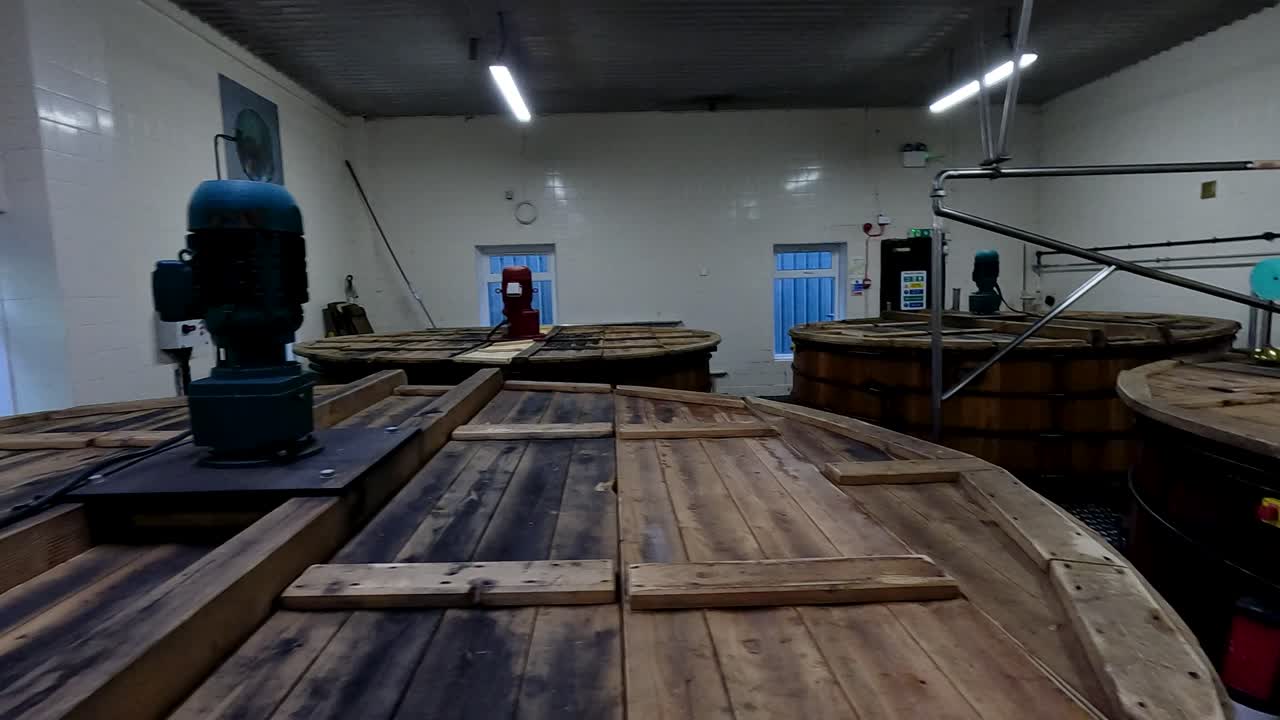 Wooden tanks in a distillery setting