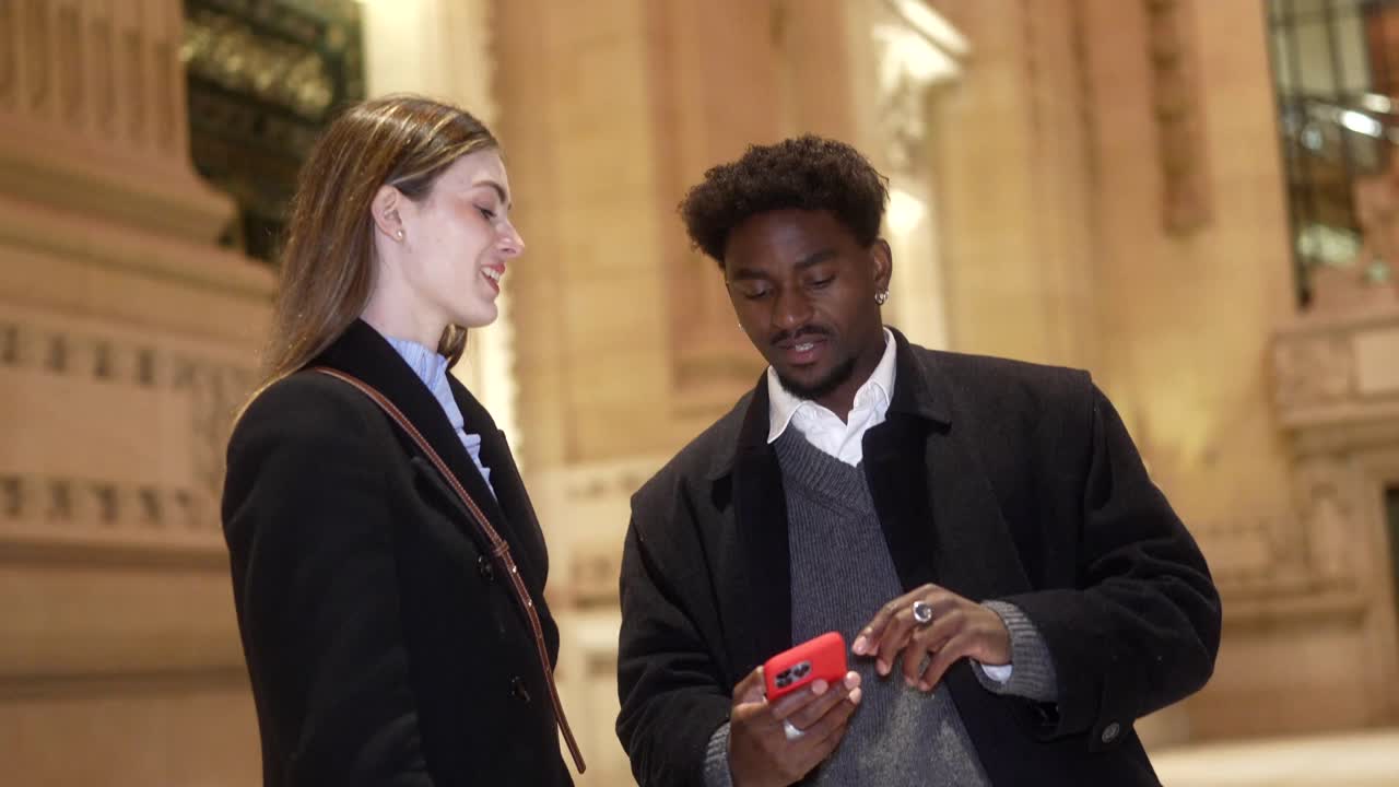 A couple looking at a smartphone