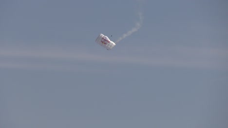 parachuter prepares to touch ground