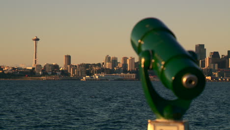 viewfinder telescope overlooking seattle skyline with rack focus to the space needle