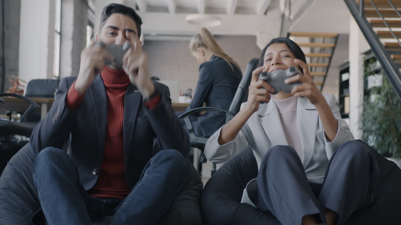 Business Colleagues Enjoying a Gaming Break in the Office