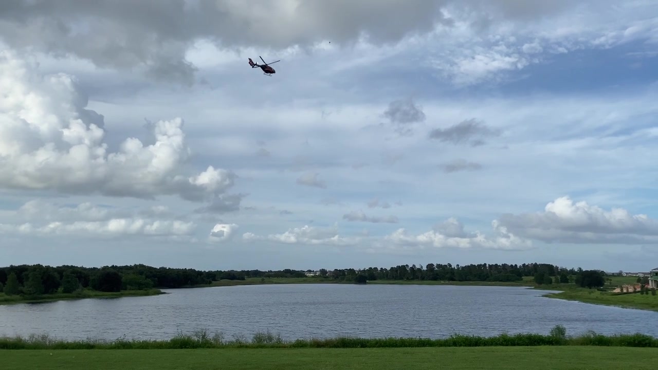 Helicopter over lake, slow motion