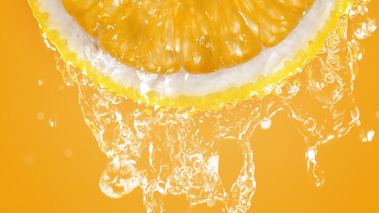 Orange Slice Splashed With Water In Slow Motion And Macro On Orange Background