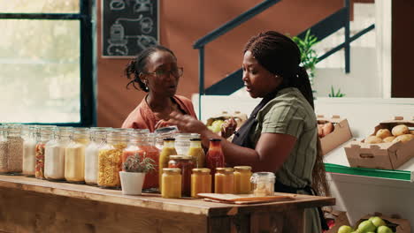 storekeeper offering food sample for a taste test in supermarket