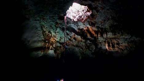 cave diving underwater scuba divers exploring cave dive mexico