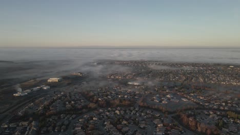 Flying-over-a-neighborhood-of-Central-Valley-in-California-towards-emerging-fog