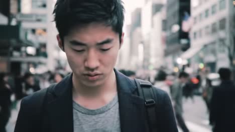 young man walking in a city