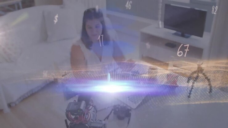 Animation of numbers changing and glowing light over female vlogger recording vlog