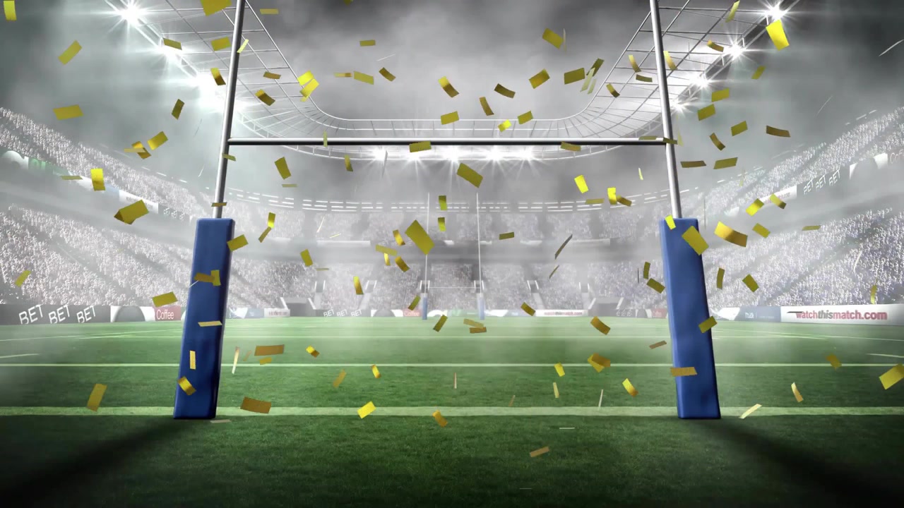Golden confetti release drifting and swirling around blue-padded rugby goal posts celebrating event