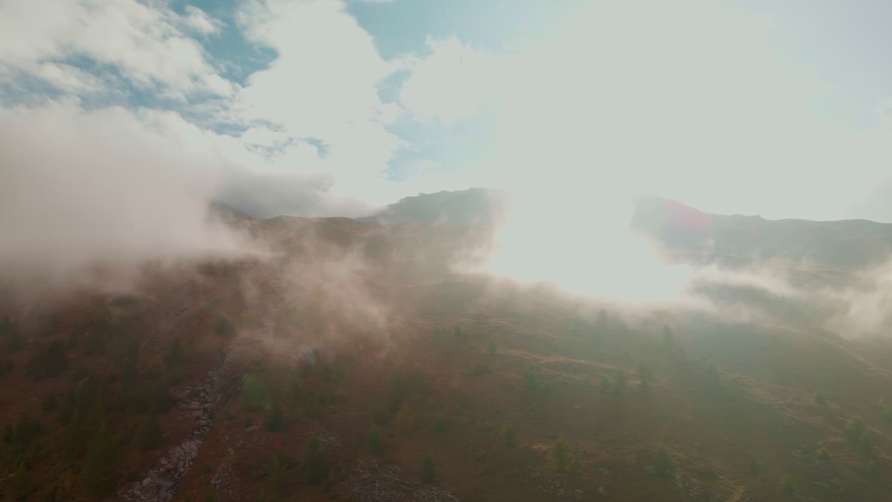 Vivid Clouds On A Sunny Sunrise Over Mountains During Foggy Morning. Aerial Drone
