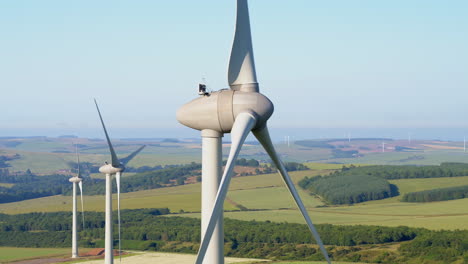 aerial footage of the a wind turbine farm in scotland