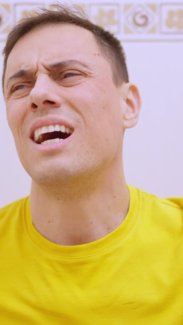 Man suffering from stomach ache while sitting on toilet