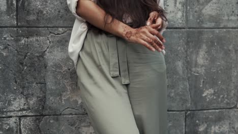 woman with henna tattooed hands