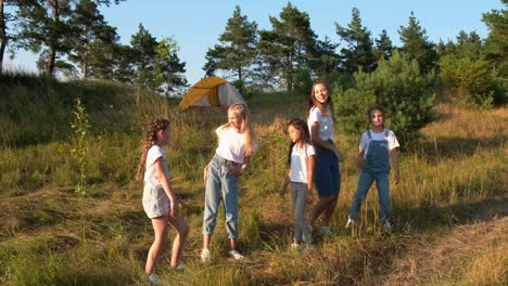 Group of girls camping in the forest
