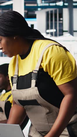 vertical video african american female employee testing multiple solar panel designs