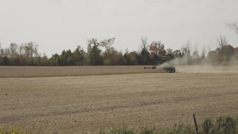 Harvester-Tractor-Harvesting-Ripe-Wheat-On-Field.-wide