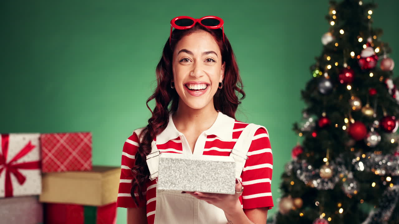 A woman holding a Christmas present