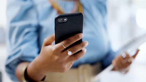 Hands,-business-phone-and-typing-in-office