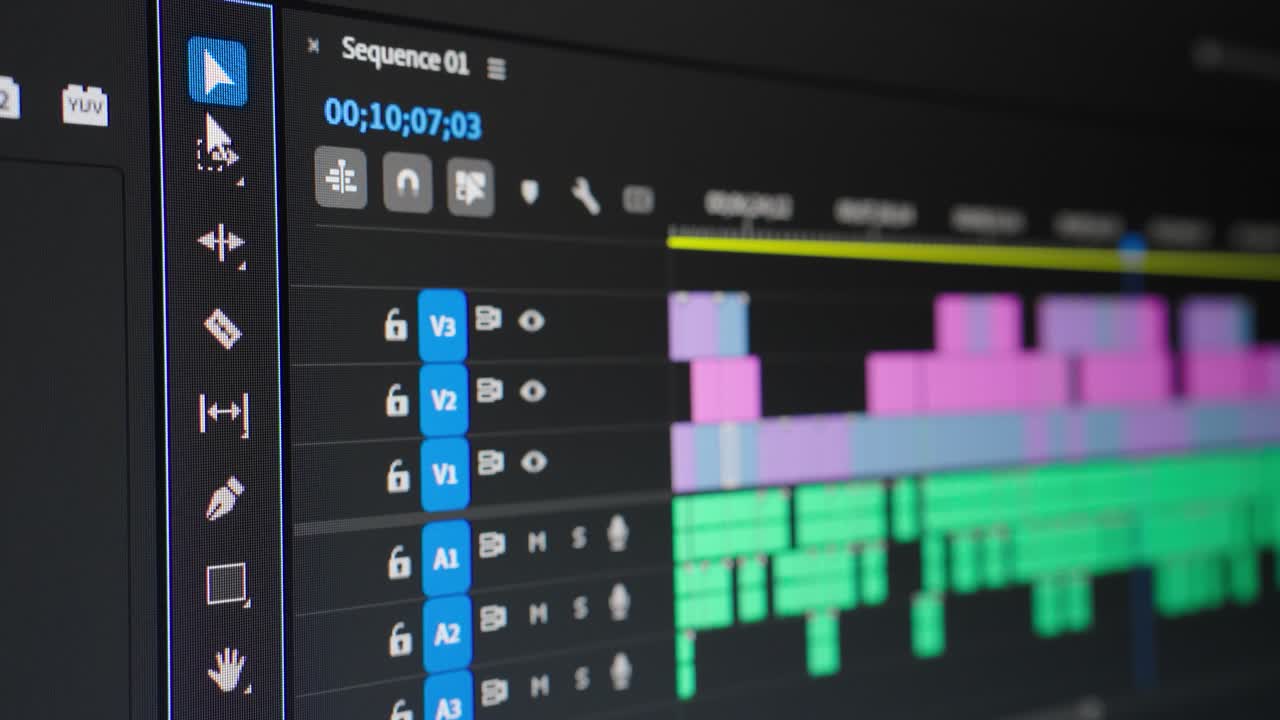 Video editing. Mouse cursor hovering over various timeline tools. Screen close up