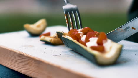 Cutting-up-a-delicious-vegan-snack-from-the-grill