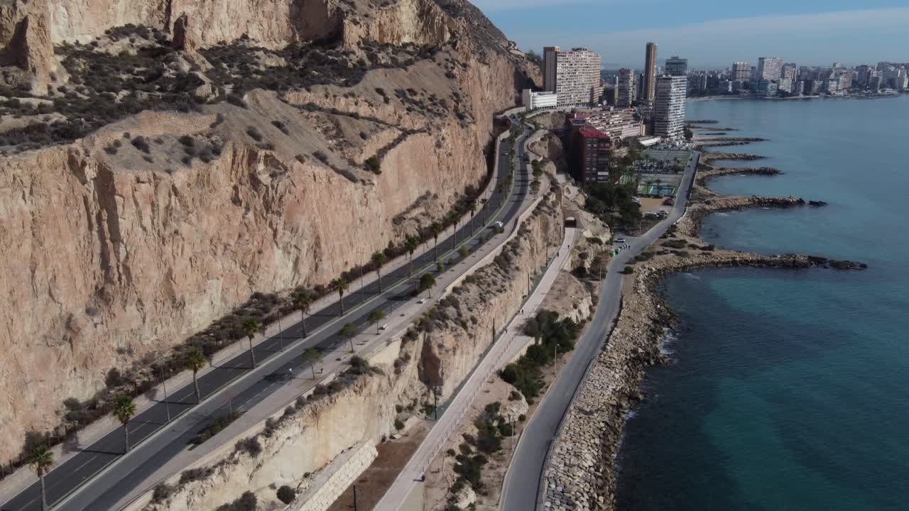 Aerial view of the coastal road and old quarry in front of the sea, Alicante, Spain