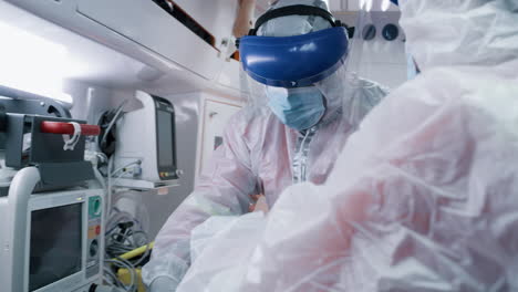 medical personnel attending to a patient in an ambulance