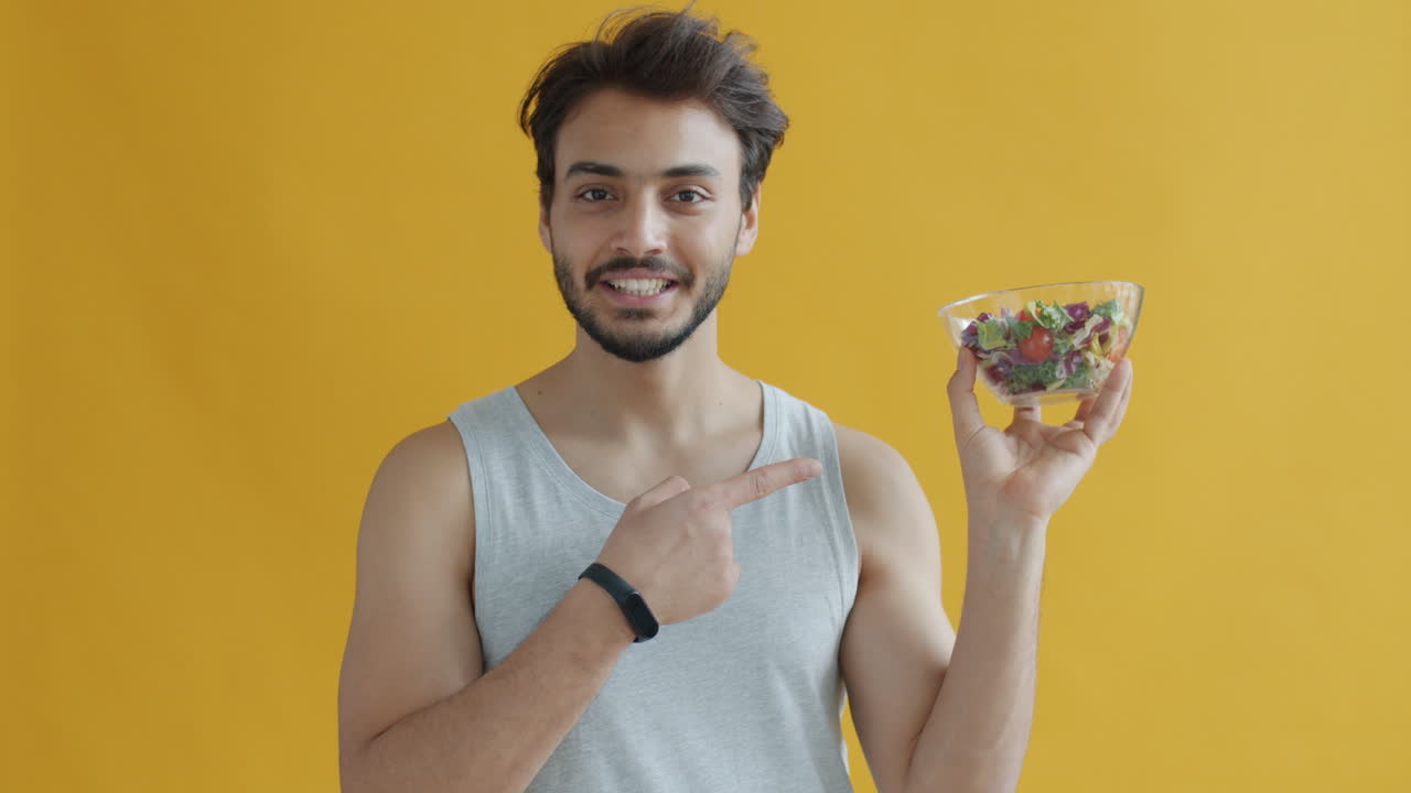 Man Holding a Salad Bowl